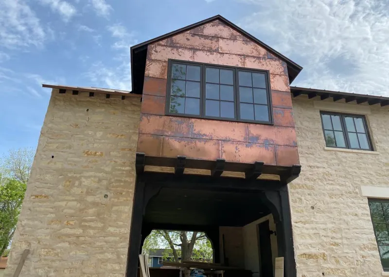 Copper metal panel facade on a stone building for Skylight Installation in Blue Ash